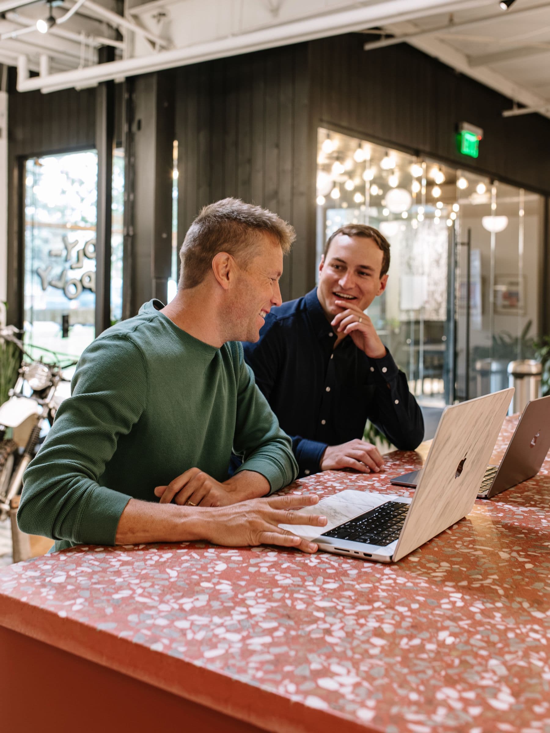 Christian laughing with a client mid-session