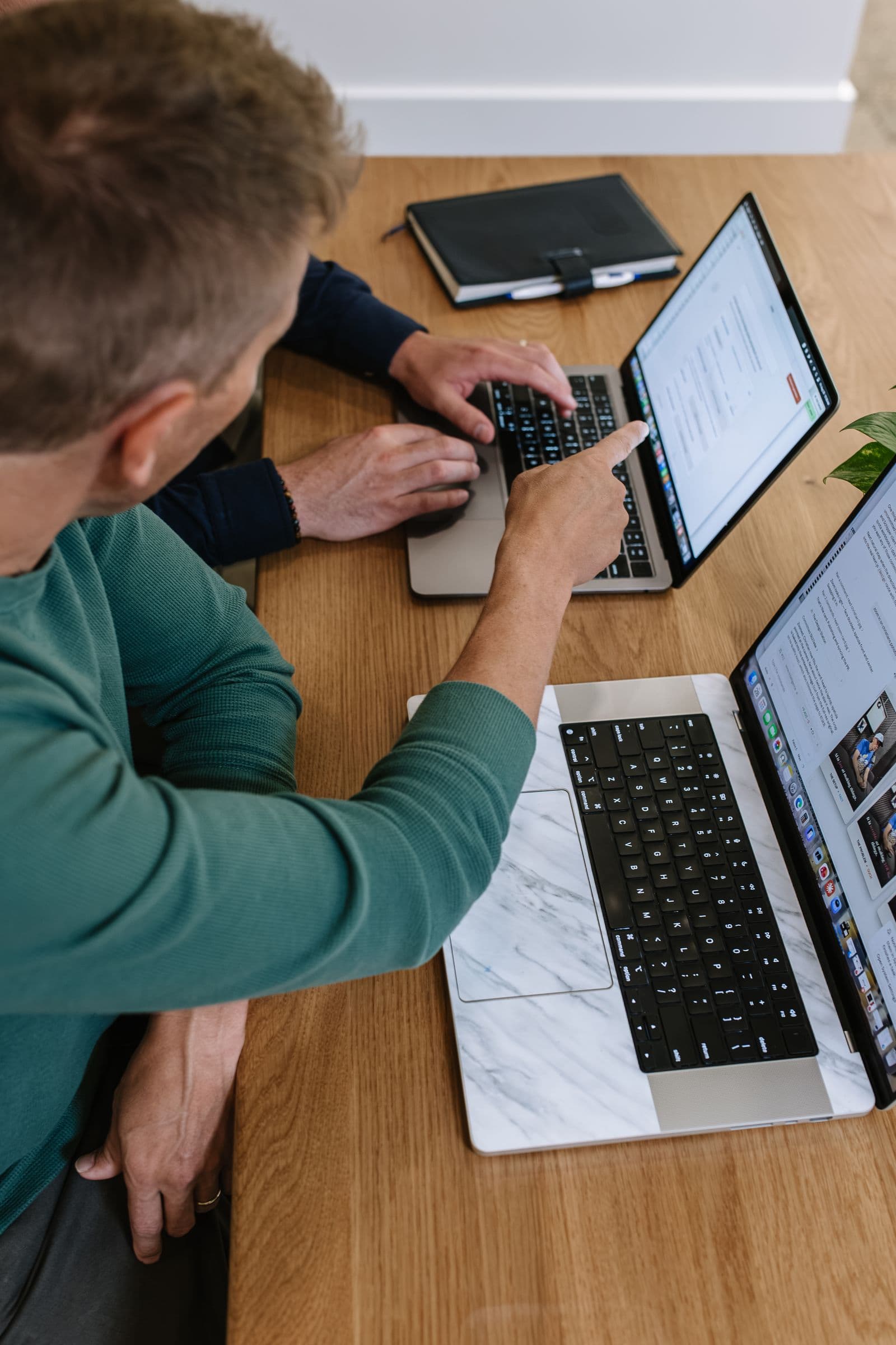 Christian pointing out a step on a client's screen
