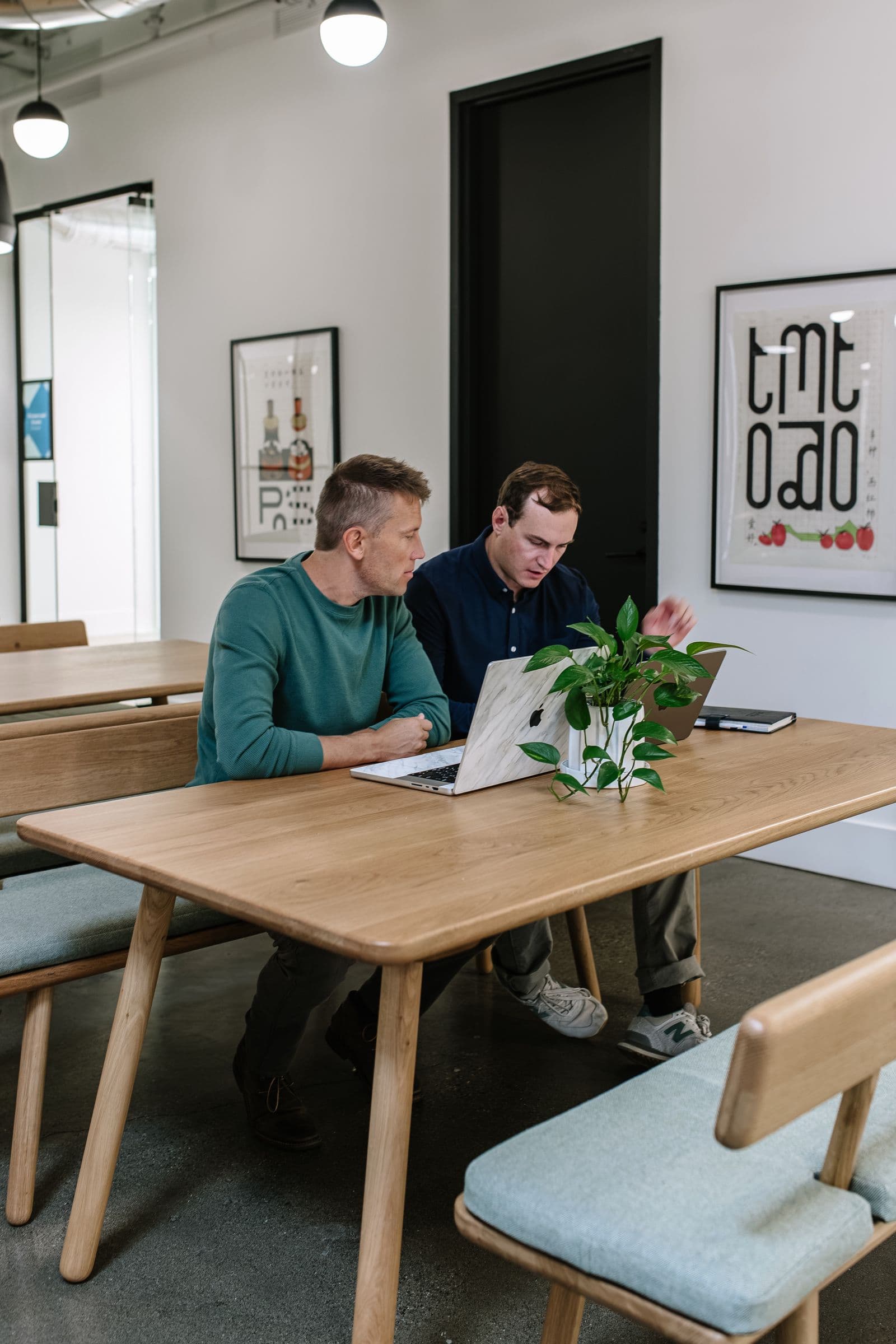 Christian working with a client at a shared table